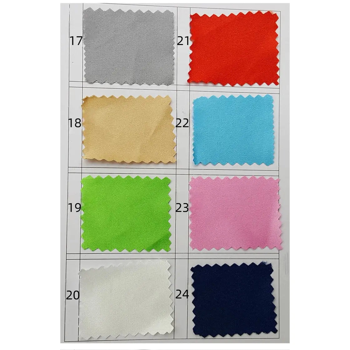 Neuf échantillons de Tissu en satin multicolore au mètre de Longan Craft France, dans une grille de 3x3 sur fond blanc, sont numérotés de 17 à 24. Ils sont réalisés en polyester satiné soyeux, idéal pour l'habillement.
