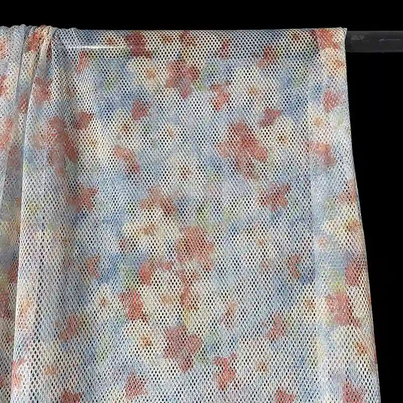 Tissu filet camouflage coloré au mètre
