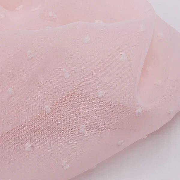 Mousseline à plumetis au mètre de Longan Craft France : tissu mousseline jacquard doux, semi-transparent, avec petits pois blancs en relief et texture légère, idéale pour vos créations colorées.