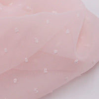 Mousseline à plumetis au mètre de Longan Craft France : tissu mousseline jacquard doux, semi-transparent, avec petits pois blancs en relief et texture légère, idéale pour vos créations colorées.