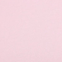 Un gros plan du Jersey bambou uni avec élasthanne au mètre de Longan Craft France montre sa surface rose pâle, finement texturée et sans motif, idéale comme textile doux pour les vêtements de détente et d'intérieur.