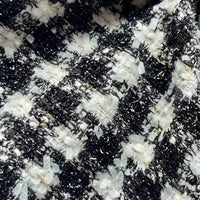 Tissu tweed noir et blanc au mètre