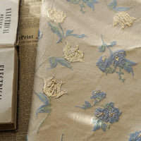 Tissu jacquard brocart fleur bleue au mètre