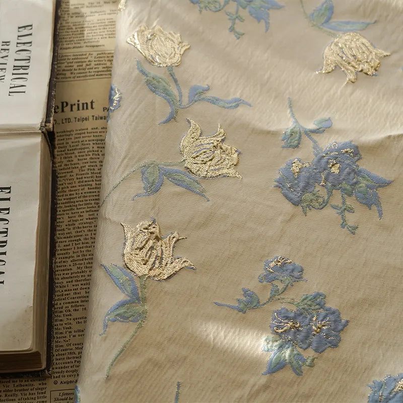 Tissu jacquard brocart fleur bleue au mètre
