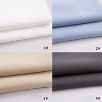 Quatre tissus gabardine polyester-rayon de Longan Craft France sont disposés : blanc (1#) en haut à gauche, bleu clair (2#) en haut à droite, beige (3#) en bas à gauche, et gris foncé (4#) en bas à droite - parfaits pour les uniformes de bricolage.