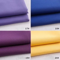 Quatre échantillons de gabardine Longan Craft France pliés sont empilés dans une grille : violet clair (17#) en haut à gauche, bleu (18#) en haut à droite, violet foncé (19#) en bas à gauche, et jaune (20#) en bas à droite. Polyester-rayon épais pour uniformes/DIY.