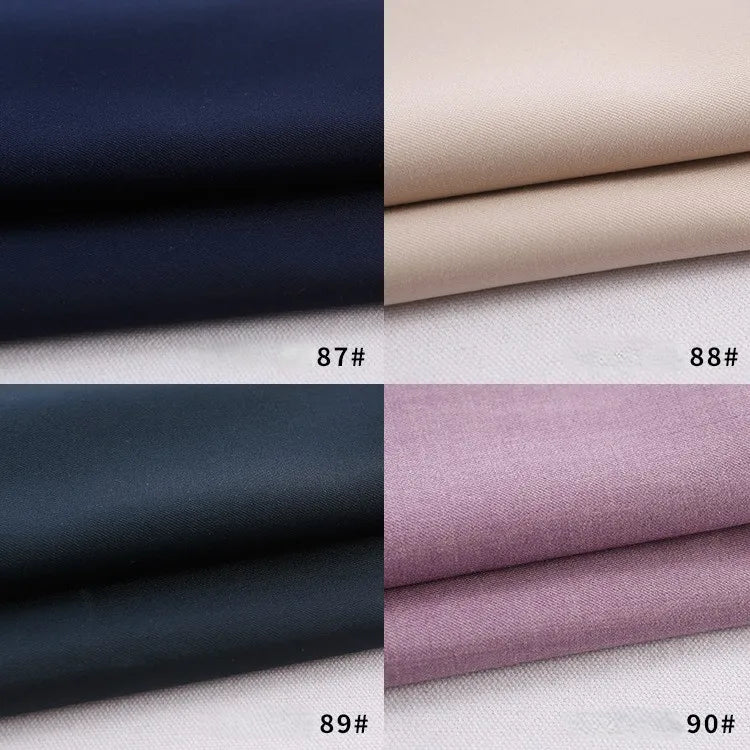 Quatre échantillons de tissu - bleu foncé (87#), beige (88#), noir (89#), violet clair (90#) - sont étiquetés et pliés, mettant en valeur la gabardine épaisse de polyester-rayon de Longan Craft France au mètre, idéale pour les uniformes de bricolage.