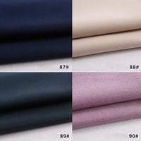 Quatre échantillons de tissu - bleu foncé (87#), beige (88#), noir (89#), violet clair (90#) - sont étiquetés et pliés, mettant en valeur la gabardine épaisse de polyester-rayon de Longan Craft France au mètre, idéale pour les uniformes de bricolage.
