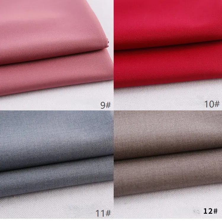 Quatre échantillons pliés de tissu gabardine Longan Craft France en rose (9#), rouge (10#), gris (11#) et beige (12#) sont présentés empilés dans une grille. Chaque tissu épais en rayonne-polyester est clairement étiqueté avec son numéro de produit.