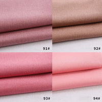 Quatre piles de tissu plié Longan Craft France gabardine polyester-rayon en rose et marron (91#, 92#, 93#, 94#). Chaque pièce solide et lisse est parfaite pour les uniformes ou les projets de bricolage. Disponible au mètre pour une créativité éclatante.