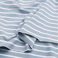 Un gros plan du Tissu French Terry extensible rayé coloré au mètre de Longan Craft France montre son tissu bleu clair avec des rayures blanches horizontales, délicatement plié pour révéler la douceur de la maille de coton - idéal pour la fabrication de sweatshirts.