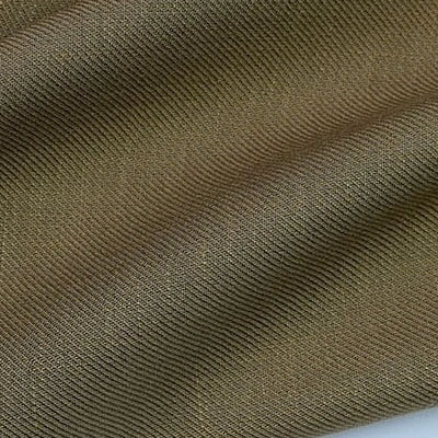 Gros plan sur le Tissu lyocell sergé coloré au mètre de Longan Craft France, un tissu 100 % lyocell, respectueux de l'environnement, avec des crêtes texturées et des plis ondulés, soulignant sa douceur et sa durabilité - idéal pour des costumes confortables.