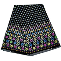 Le Tissu wax africain Ankara coloré au mètre de Longan Craft France présente un motif floral vibrant avec des fleurs plus grandes en bas et plus petites en haut, idéal pour les styles vestimentaires à la mode.