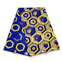 Un morceau plié de Tissu wax africain Ankara coloré au mètre par Longan Craft France, présentant un imprimé géométrique audacieux en bleu, jaune, orange et noir avec des motifs hexagonaux et étoilés - parfait pour les styles vestimentaires à la mode.