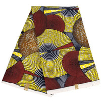 Le Longan Craft France Tissu wax africain Ankara coloré au mètre présente un motif vibrant de cercles concentriques jaunes, rouges, noirs et blancs avec des lignes diagonales, parfait pour divers styles vestimentaires.