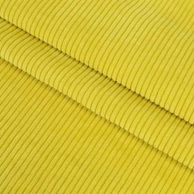 Gros plan sur trois pièces empilées de "Velours côtelé coton 8 côtes uni au mètre" de Longan Craft France, montrant des crêtes en relief - idéal pour confectionner des vêtements, des accessoires ou de la décoration avec ce velours côtelé de coton de haute qualité.