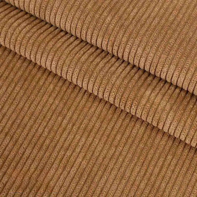 Gros plan sur plusieurs pièces pliées de Velours côtelé coton 8 côtes uni de Longan Craft France, mettant en évidence la qualité de la texture nervurée verticale, idéale pour les vêtements, les accessoires et la décoration.