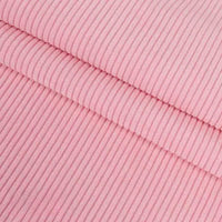 Gros plan sur le Velours côtelé coton 8 côtes uni de Longan Craft France, plié pour révéler sa texture nervurée verticale - idéal pour les vêtements, les accessoires et les projets de bricolage déco.