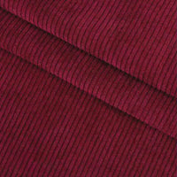 Un gros plan du Velours côtelé coton 8 côtes uni au mètre de Longan Craft France, en rouge foncé, révèle des stries verticales texturées, parfaites pour les vêtements, les accessoires ou les projets de bricolage décoratif.