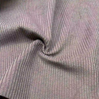 Un gros plan du Velours côtelé coton 8 côtes uni au mètre de Longan Craft France montre sa couleur brun clair, ses stries verticales et son tourbillon subtil - idéal pour les vêtements, les accessoires ou les projets de décoration.