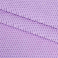 Gros plan sur le Velours côtelé coton 8 côtes uni de Longan Craft France, qui met en évidence ses stries parallèles texturées, idéales pour les vêtements, les accessoires et les projets de décoration.