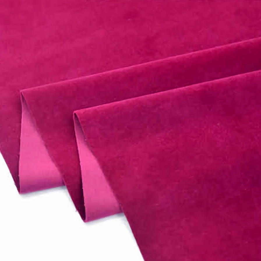 Trois feuilles de Longan Craft France Velours de coton 100% pur au mètre, un tissu velours de coton uni doux et lisse pour la couture et l'artisanat, sont partiellement pliées sur un fond blanc avec des bords nets et précis.