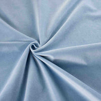 Gros plan sur les Velours de coton 100% pur au mètre de Longan Craft France, disposés en tourbillon pour montrer la texture douce et lisse de ce tissu velours bleu clair uni idéal pour la couture, les loisirs créatifs et l'ameublement.