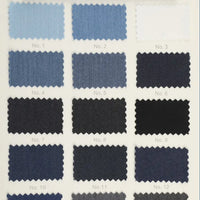 Une grille de 12 échantillons de Tissu sergé de viscose coloris denim de Longan Craft France, allant des teintes claires aux teintes foncées-matière extensible idéale pour la confection de vêtements créatifs ou vestes chic.