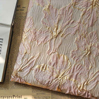 Tissu brocart à fleurs embossées dorées au mètre