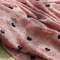 Tissu en mousseline à franges brodé de cœurs au mètre