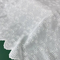 Tissu brodé ajouré blanc au mètre
