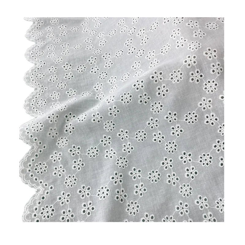 Tissu brodé ajouré blanc au mètre