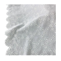 Tissu brodé ajouré blanc au mètre