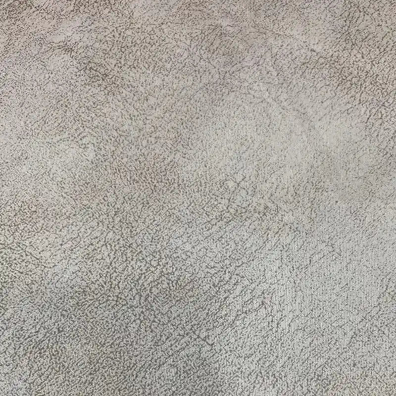 Gros plan sur une surface légère et texturée avec un motif irrégulier, similaire au tissu suédine imprimé au mètre-velours suédine motif litchi de Longon Craft France, parfait pour les manteaux, les canapés ou les projets de bricolage.