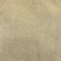Gros plan sur le tissu suédine velours beige au mètre de Longon Craft France, qui présente une texture douce à motifs de litchis, parfaite pour les manteaux, les canapés ou les projets de bricolage.