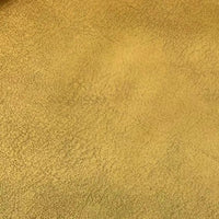 Gros plan sur le tissu suédine au mètre de Longon Craft France, qui présente un motif de litchi et une texture veloutée dans des tons brun-jaune, idéal pour le bricolage, les manteaux ou l'habillage des canapés.