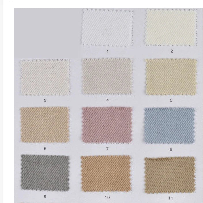 Un tableau présente 12 échantillons numérotés du tissu lyocell mélangé coton bambou multicolore au mètre de Longan Craft France, disposés en trois rangées de quatre. Chacun d'eux présente un tissage en diagonale sur fond gris clair, idéal pour les pantalons DIY.