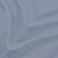 Gros plan sur le tissu multicolore Tissu lyocell mélangé coton bambou de Longan Craft France, à la texture subtilement côtelée - un textile idéal pour les pantalons DIY et disponible au mètre.