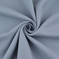 Tissu lyocell mélangé coton bambou multicolore de Longan Craft France, idéal pour pantalons DIY, est présenté en spirale mettant en valeur sa texture subtilement côtelée et son tissage lisse avec de doux plis au centre.