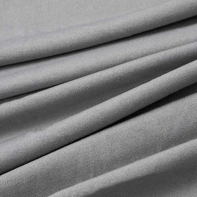 Gros plan sur le tissu jersey polyester-élasthanne multicolore au mètre de Longan Craft France, un tissu lisse, fin, léger et extensible, idéal pour les robes.