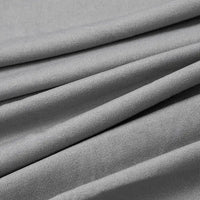 Gros plan sur le tissu jersey polyester-élasthanne multicolore au mètre de Longan Craft France, un tissu lisse, fin, léger et extensible, idéal pour les robes.