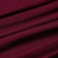 Gros plan sur un tissu jersey multicolore en polyester et élasthanne de Longan Craft France, vendu au mètre, qui présente un tissage fin, une légère brillance et une texture visible avec des plis horizontaux - idéal pour les robes.