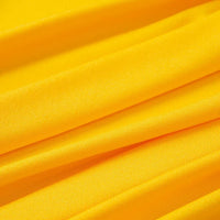 Vue rapprochée de plusieurs plis de Tissu jersey polyester multicolore au mètre de Longan Craft France, mettant en valeur la texture lisse et la couleur vibrante de ce jersey polyester-élasthanne extensible, idéal pour la confection de peignoirs.