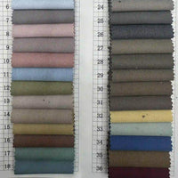 Deux colonnes d'échantillons de Tissu gabardine stretch multicolore au mètre (1-36), par Longan Craft France : tons clairs à gauche, tons plus foncés et neutres à droite - gabardine viscose idéale pour les uniformes et les costumes personnalisés.