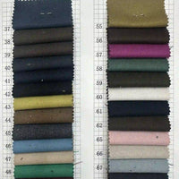 Deux colonnes de Tissu gabardine stretch multicolore au mètre de Longan Craft France sont disposées sur une grille blanche numérotée 37-67. Ce tissu en viscose offre des bleus, des verts, des bruns, des roses et des neutres - idéal pour les costumes ajustés ou les uniformes sur mesure.