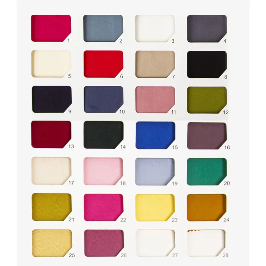 Une grille de 28 échantillons multicolores de Satin de viscose de Longan Craft France, numérotés de 1 à 28 sur quatre lignes et sept colonnes, met en valeur ce tissu 100 % viscose - idéal pour les robes de soirée - sur un fond blanc.
