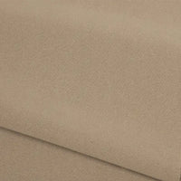 Gros plan sur un tissu éponge beige plié de Longan Craft France, à la texture lisse et régulière et au tissage fin. Idéal pour les vêtements d'hiver douillets. Tissu French terry uni au mètre, polyester, doux et parfait pour vêtements d'hiver.