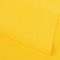 Un gros plan de Tissu French terry uni au mètre de Longan Craft France montre un tissu en polyester doux, jaune vif, au tissage subtil. Les pièces superposées dans une lumière uniforme mettent en valeur la texture de la matière, idéale pour les vêtements d'hiver confortables.