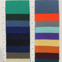 Un tableau présente des échantillons de gabardine Tissu 100% polyester de Longan Craft France, avec des couleurs vertes, bleues, noires, beiges, oranges et autres - idéal pour choisir une gabardine sergée uni de qualité pour les gilets élégants.