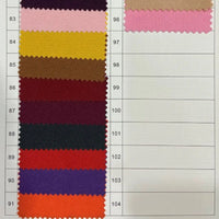 Un tableau vertical présente des échantillons de tissu numérotés 83-92 en rose, jaune, marron, rouge, bleu marine, orange et violet sur une grille blanche - parfait pour choisir le Tissu gabardine 100 % polyester au mètre de Longan Craft France pour des vestes élégantes.
